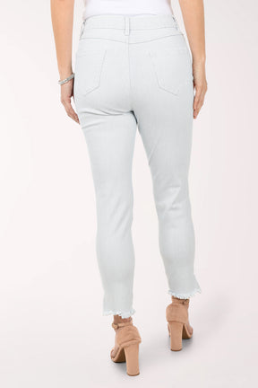 Person wearing light blue jeans with a white background