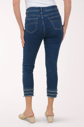 Person wearing blue jeans on a white background