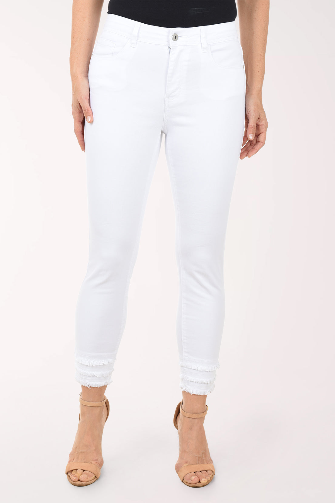 White jeans worn by a person on a white background