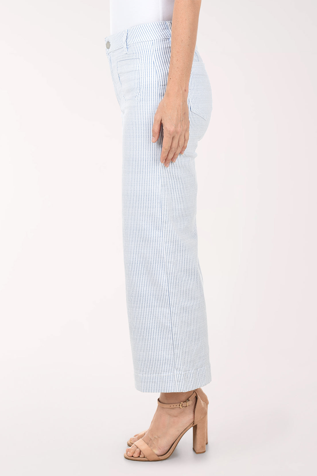 Light blue and white striped pants worn by a person on a white background