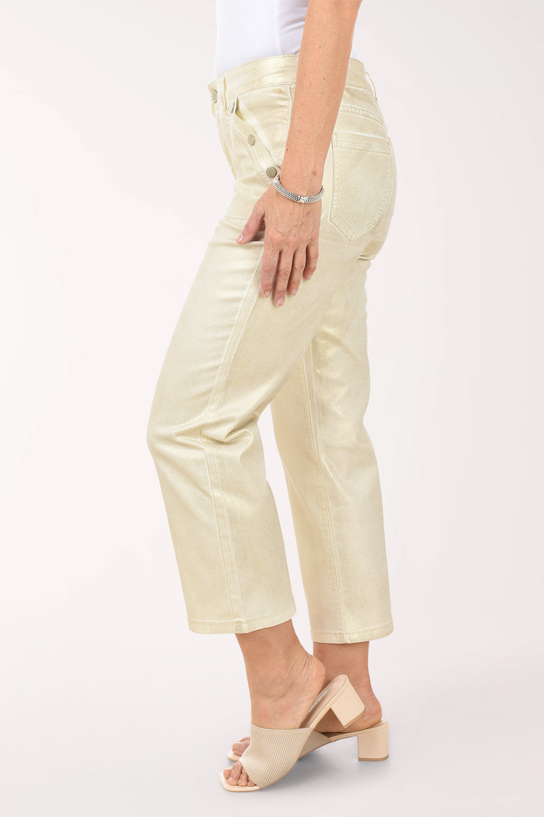 Person wearing light-colored pants on a white background