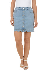 Light blue denim skirt worn by a person on a white background