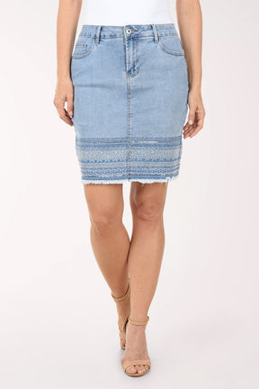 Light blue denim skirt worn by a person on a white background