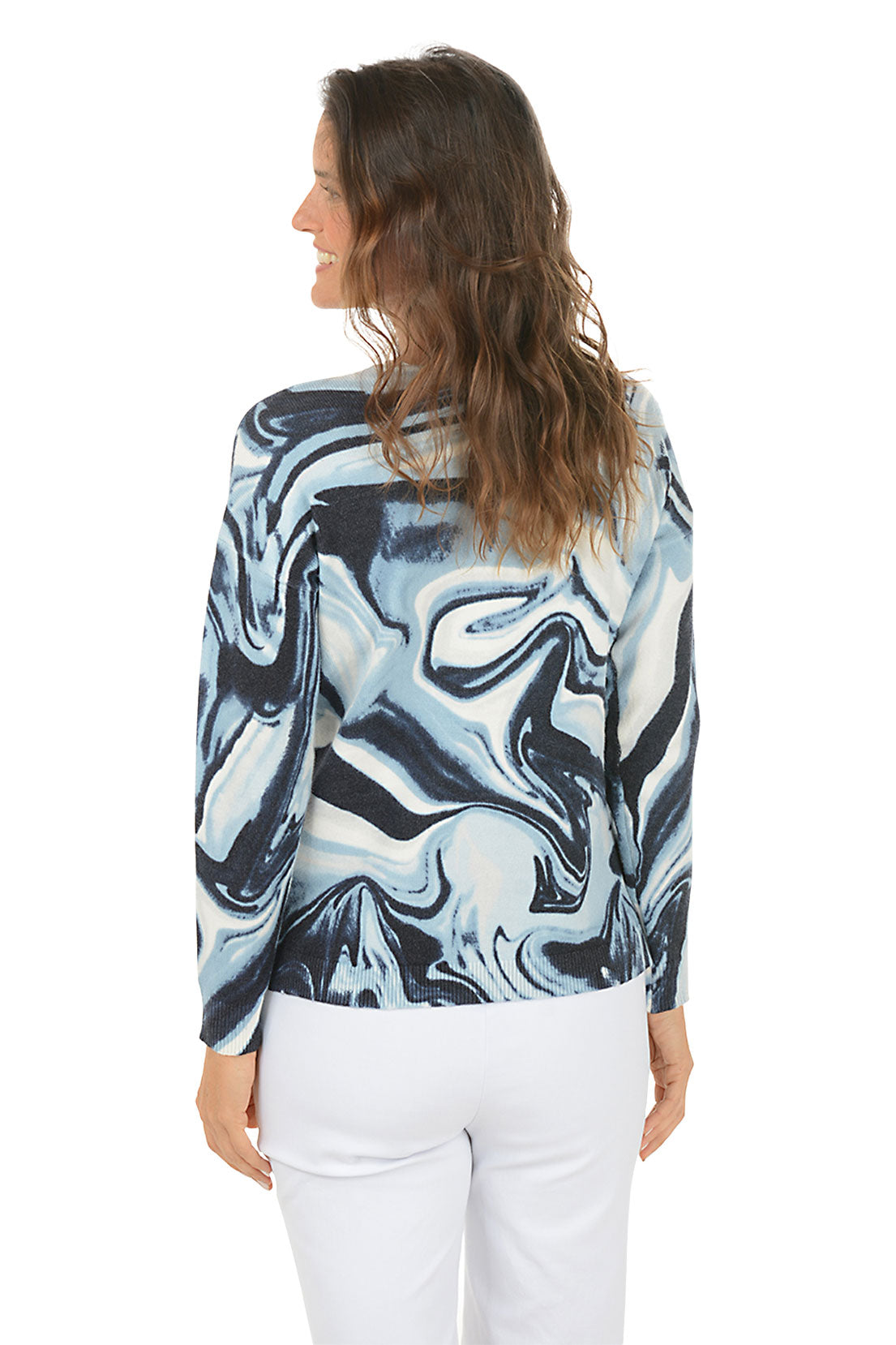 Woman wearing a blue and white marbled long-sleeve sweater on a white background. Back shot.