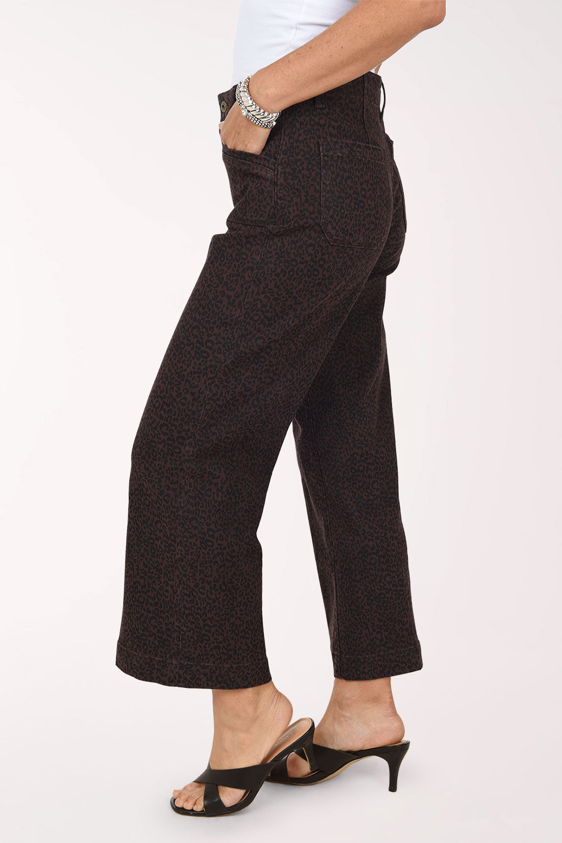 A side view of the brown leopard print wide leg jeans showing the cropped ankle length.