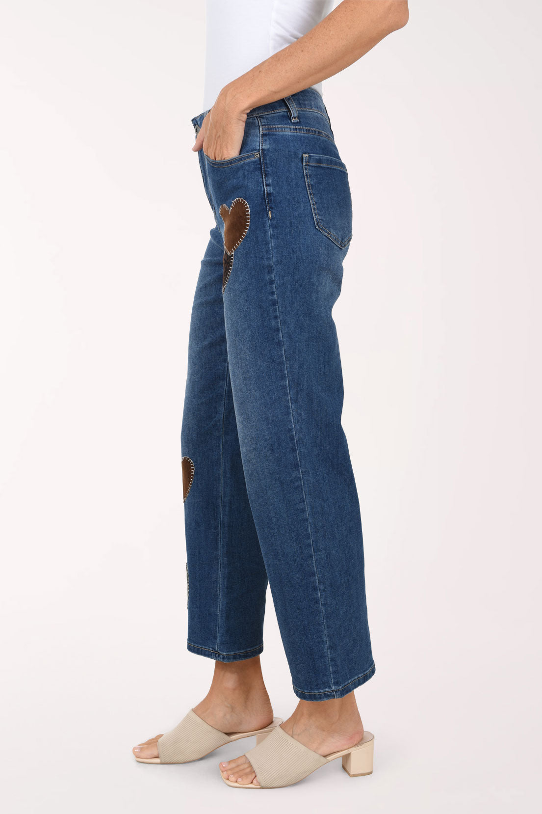 A side view of the heart patch straight leg jeans showing the ankle-length leg.