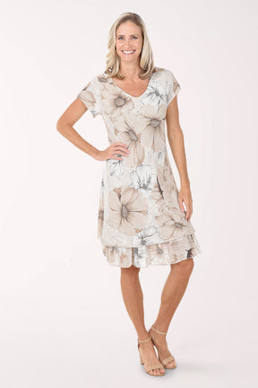 Woman wearing a floral dress on a white background