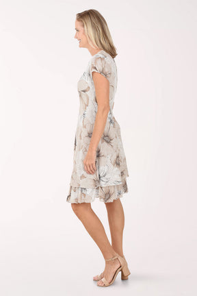 Woman wearing a floral dress on a white background
