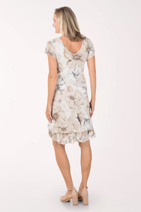 Woman wearing a floral dress on a white background