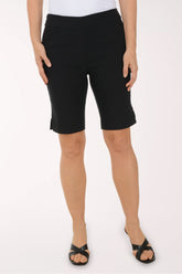 Person wearing black shorts on a white background