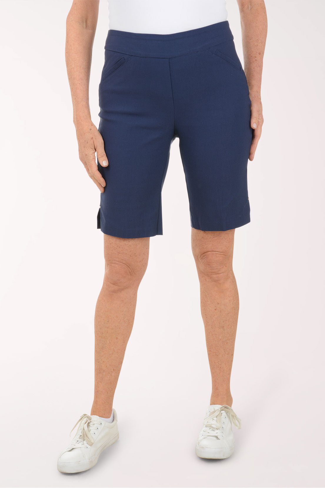 Person wearing blue shorts on a white background