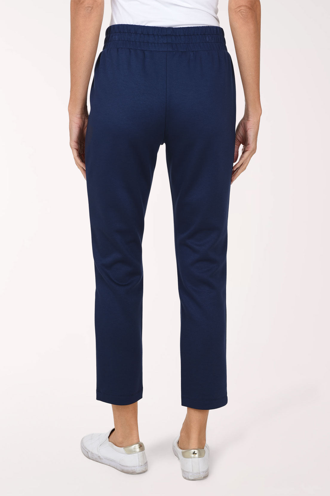 Back view of navy Jet Blue scuba straight leg pants showing the smocked waistband and smooth straight leg.