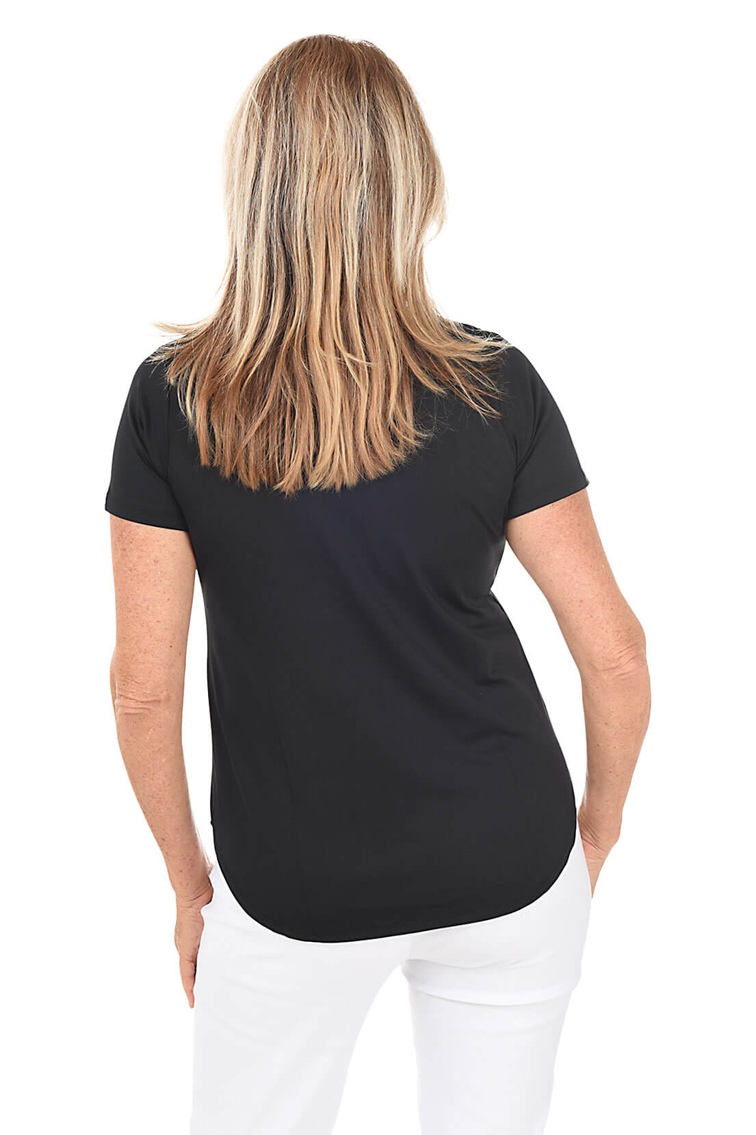 A woman wearing a black split v-neck tee with short sleeves and standing in front of a white background. Back shot.