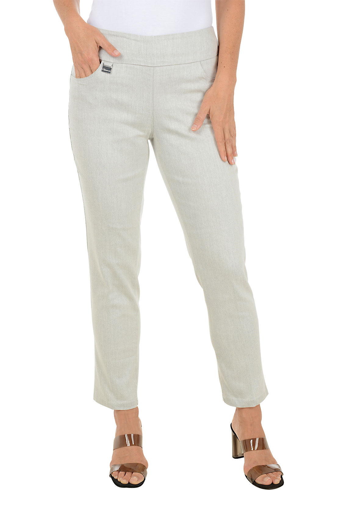 Silver ankle pants worn by a woman on a white background.