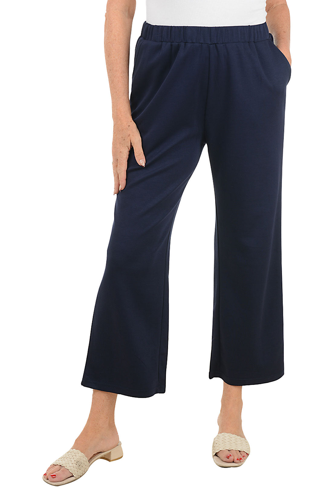 Navy blue wide-leg pants worn by a person on a white background