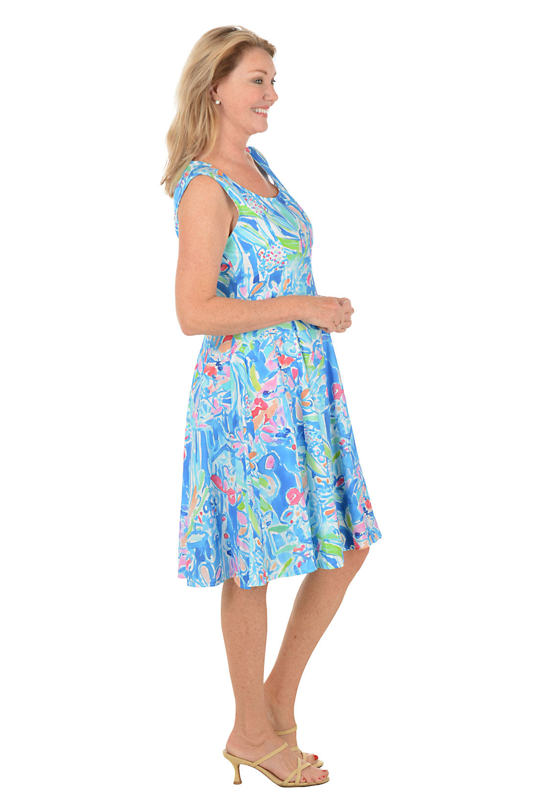 Woman wearing a colorful dress with a white background