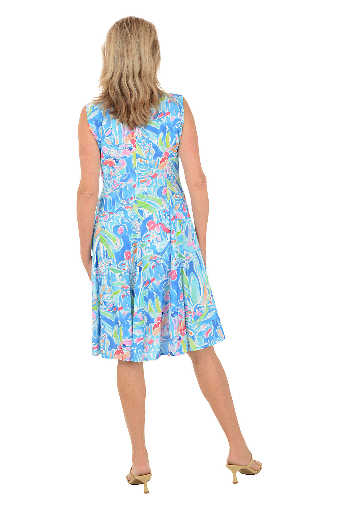 Woman wearing a colorful dress with a white background