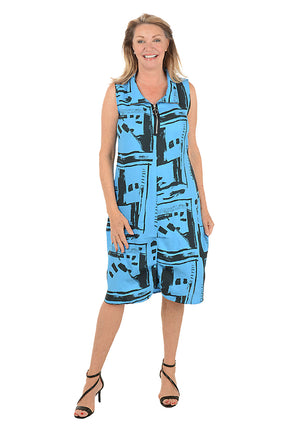 Woman wearing a blue patterned dress on a white background