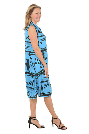 Woman wearing a blue patterned dress on a white background