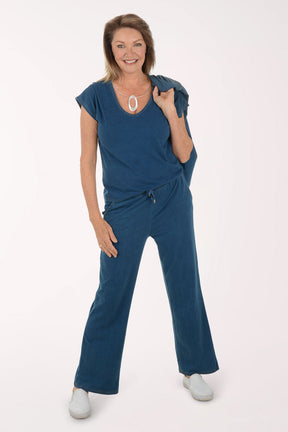 Woman wearing a blue outfit on a white background