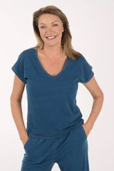 Woman wearing a blue outfit on a white background