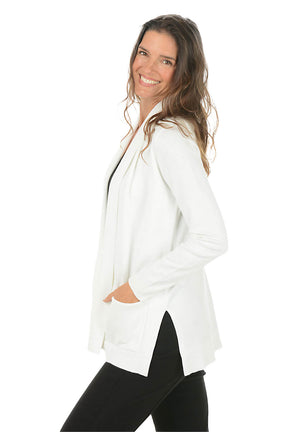 Woman wearing a white blazer on a white background