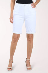 Person wearing white bermuda shorts on a white background