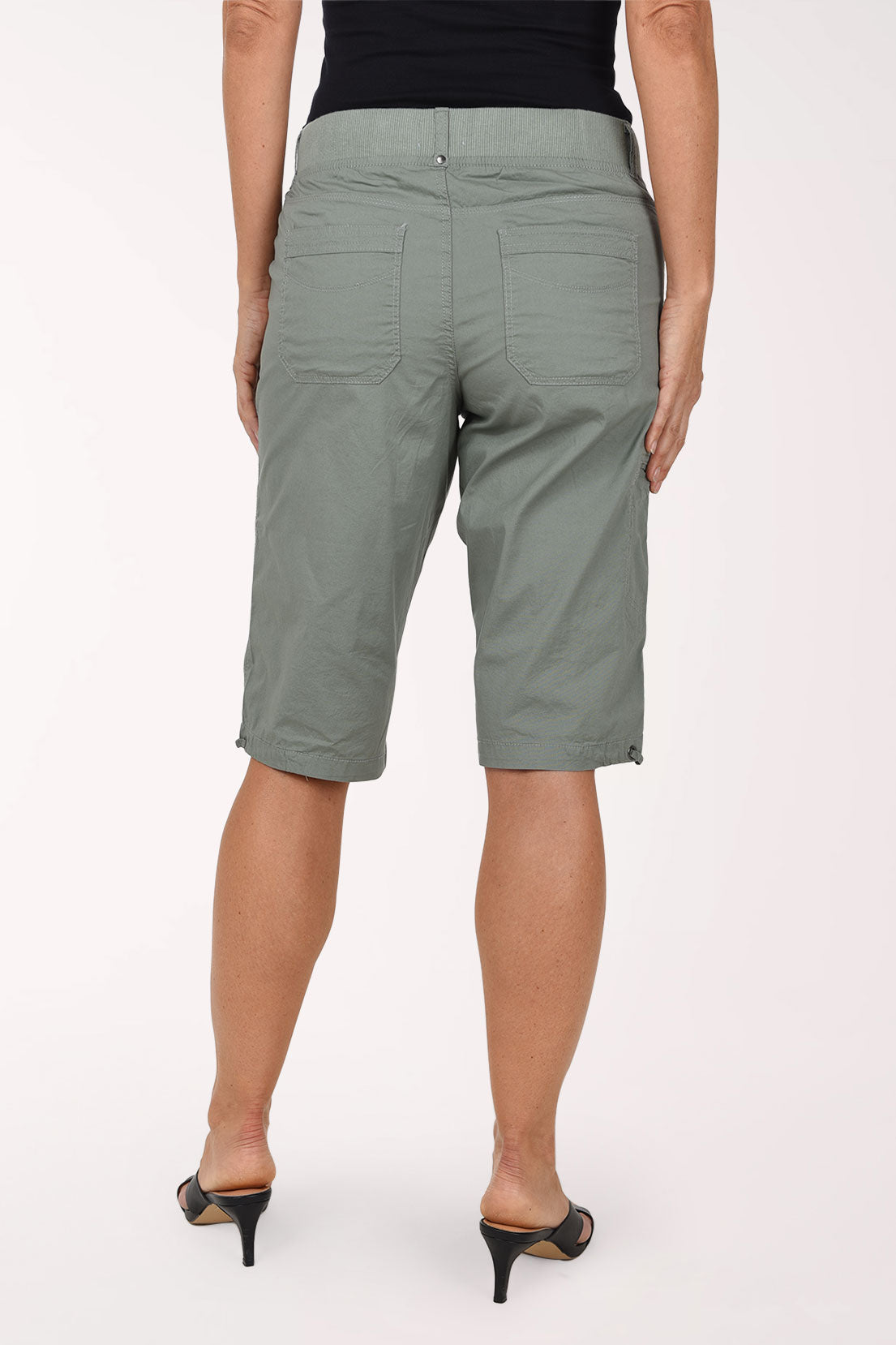 Woman wearing grey bermuda shorts 