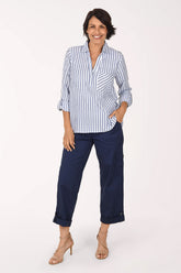 Woman wearing a navy and white striped blouse with navy cropped pants