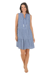 Woman wearing a blue dress on a white background
