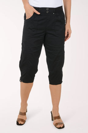 Woman wearing solid black capri pants.