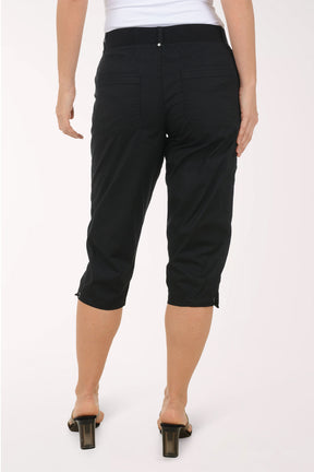 Woman wearing solid black capri pants.