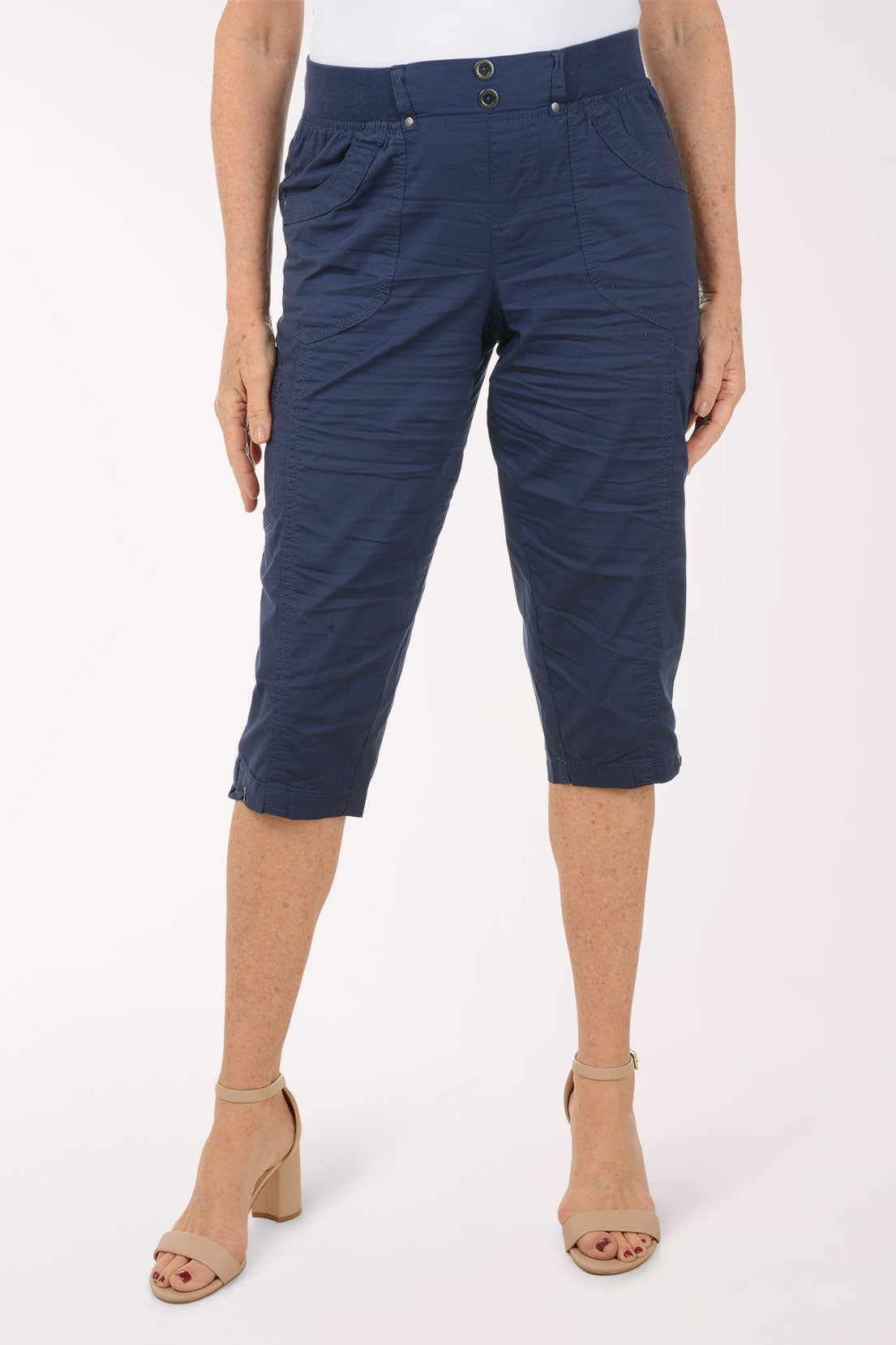 Woman wearing solid navy capri pants.