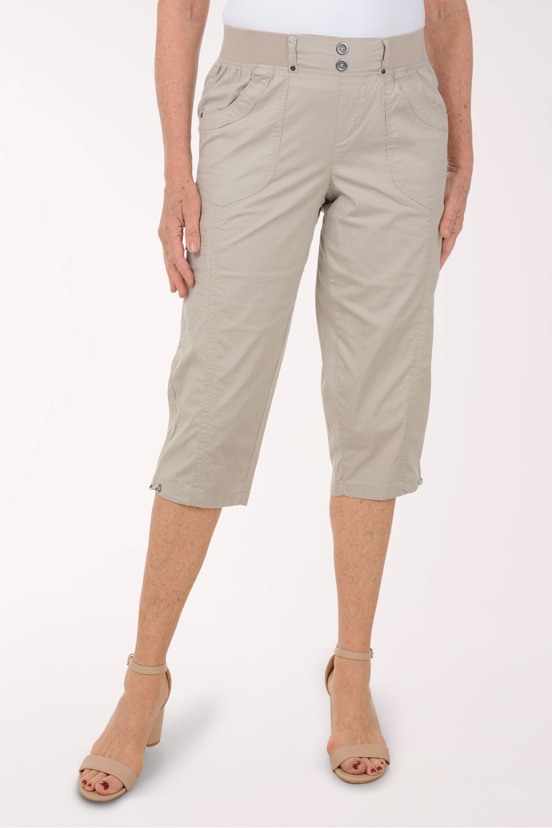 Woman wearing solid brown capri pants.
