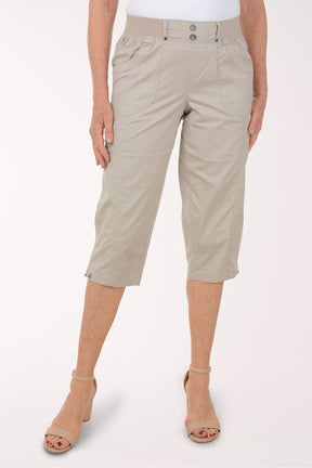 Woman wearing solid brown capri pants.