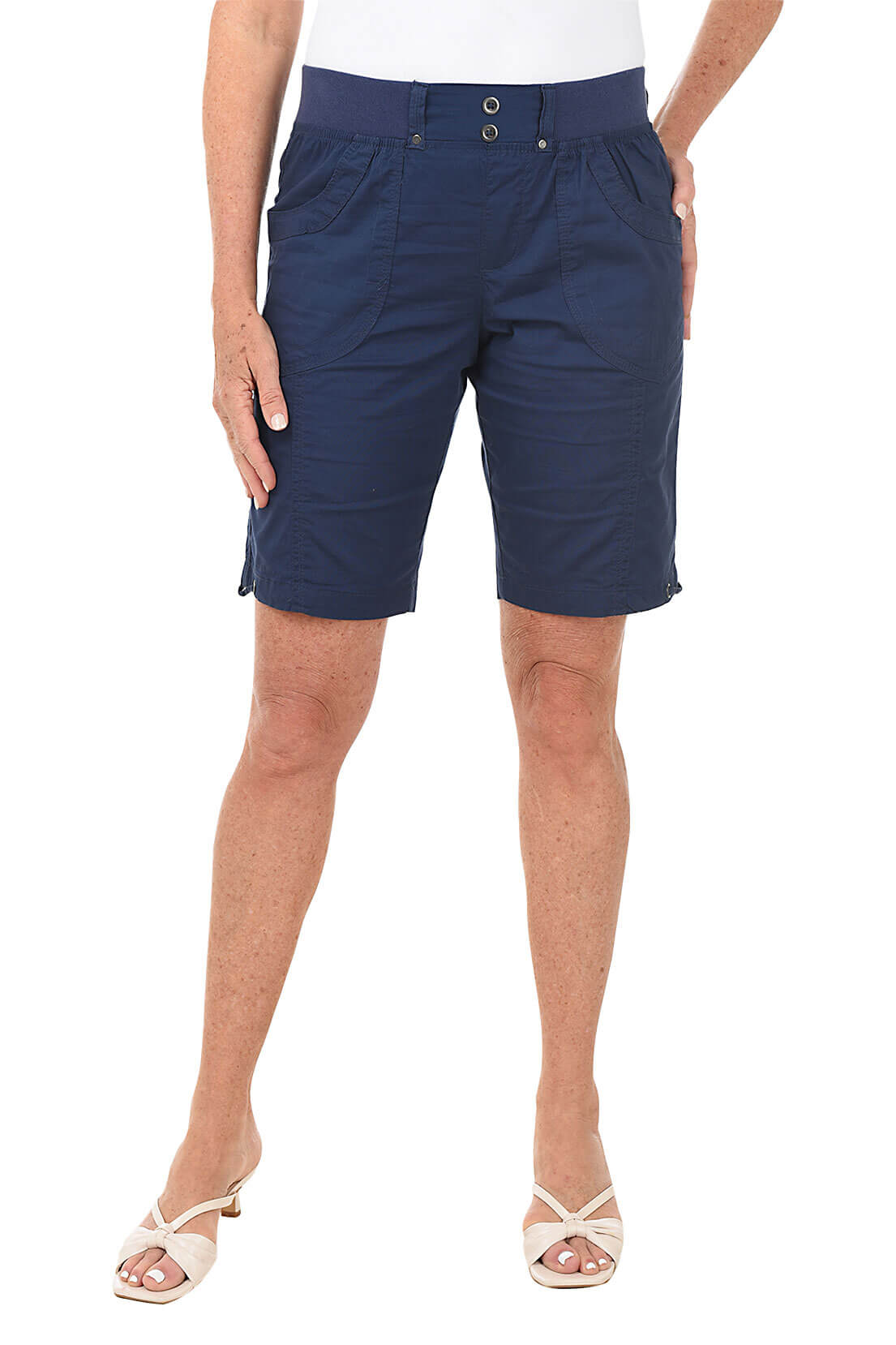 Navy blue shorts worn by a person on a white background