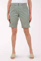 Person wearing green shorts on a white background