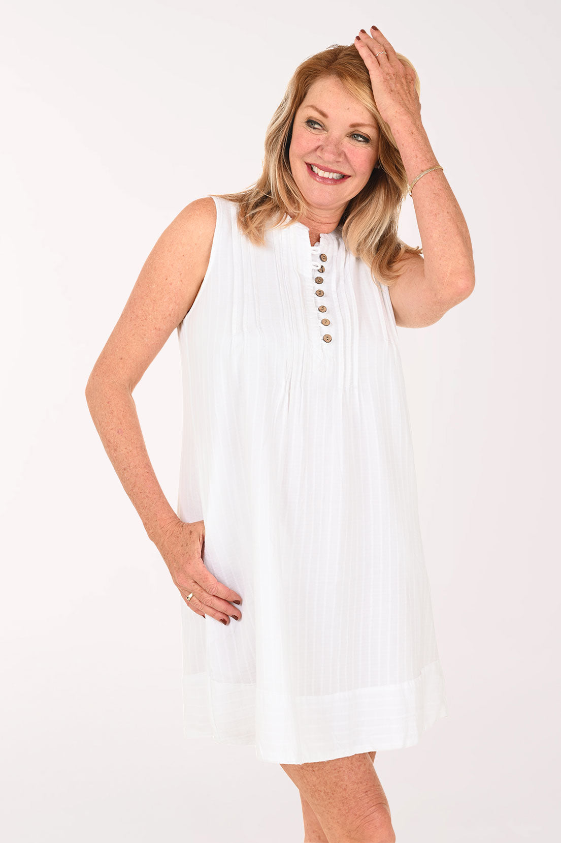 Woman wearing a white sleeveless dress