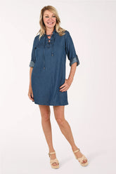 Woman wearing a denim blue dress 