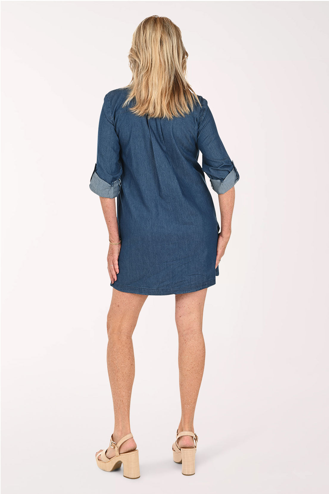 Woman wearing a denim blue dress 