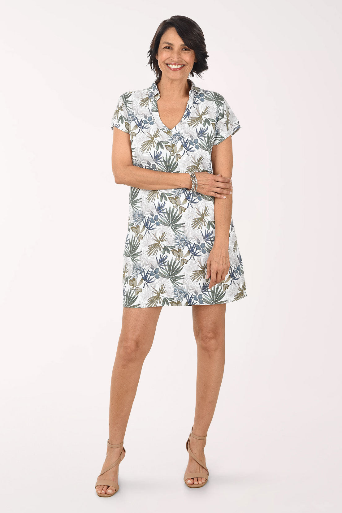 Woman wearing a floral dress on a white background