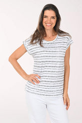 Woman wearing a short sleeve black and white striped top