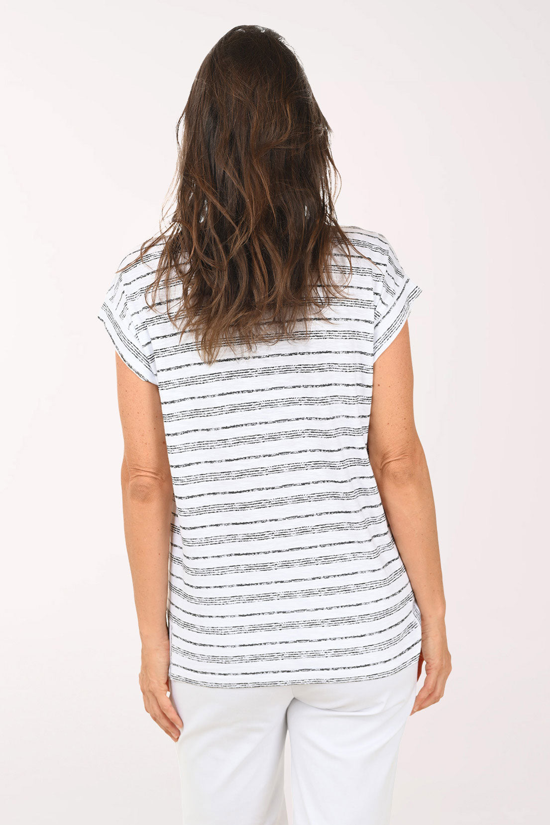 Woman wearing a short sleeve black and white striped top