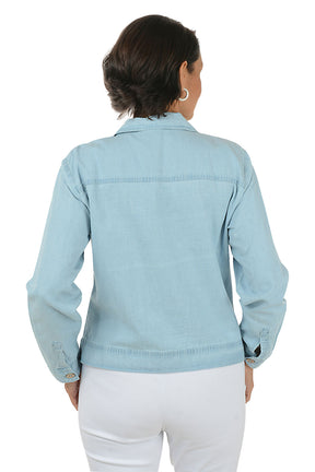 Woman wearing a light blue denim jacket on a white background. Back shot.