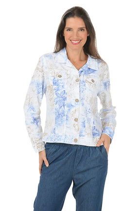 Woman wearing a floral button-up shirt and blue pants on a white background
