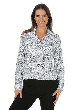 Woman wearing a patterned buttoned jacket with a white background.