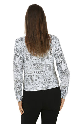 Woman wearing a patterned buttoned jacket with a white background. Back shot.