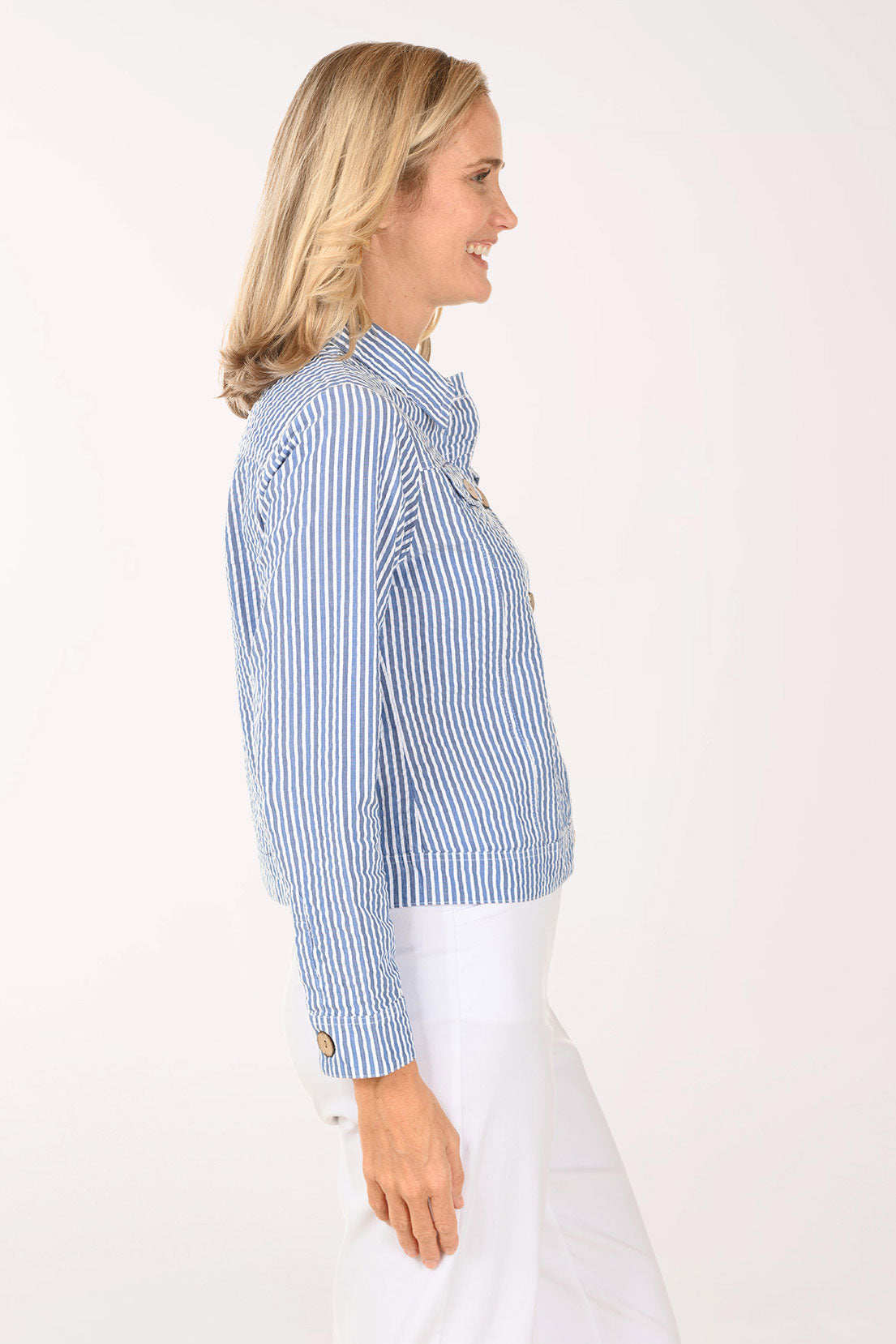 Woman wearing a striped blue and white jacket