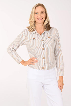 Woman wearing a striped brown and white jacket