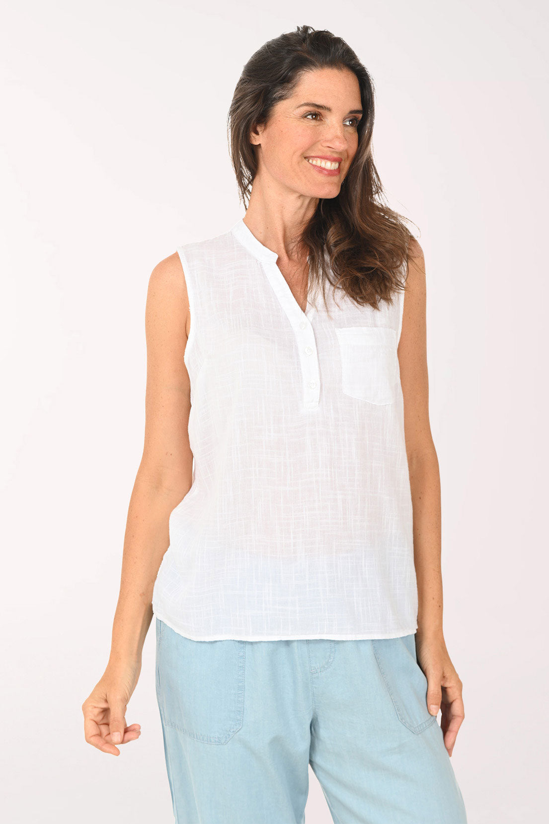 Woman wearing a white sleeveless top